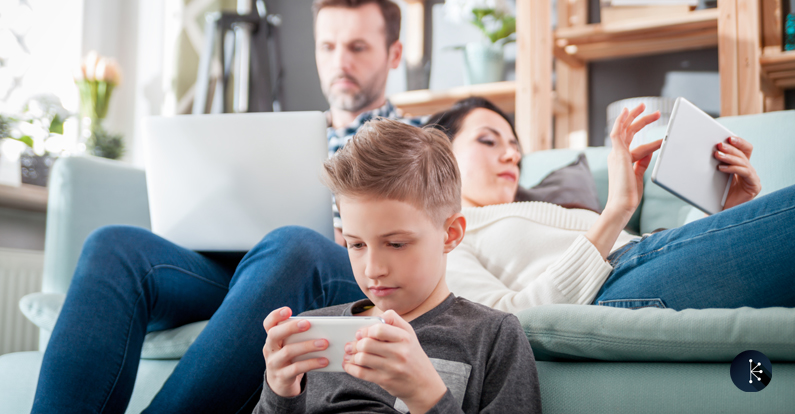 Mariner - Cybersecurity Awareness Month - Family using wireless devices in their home