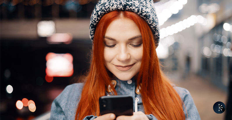 Mariner - Cybersecurity - Woman using mobile phone outdoors